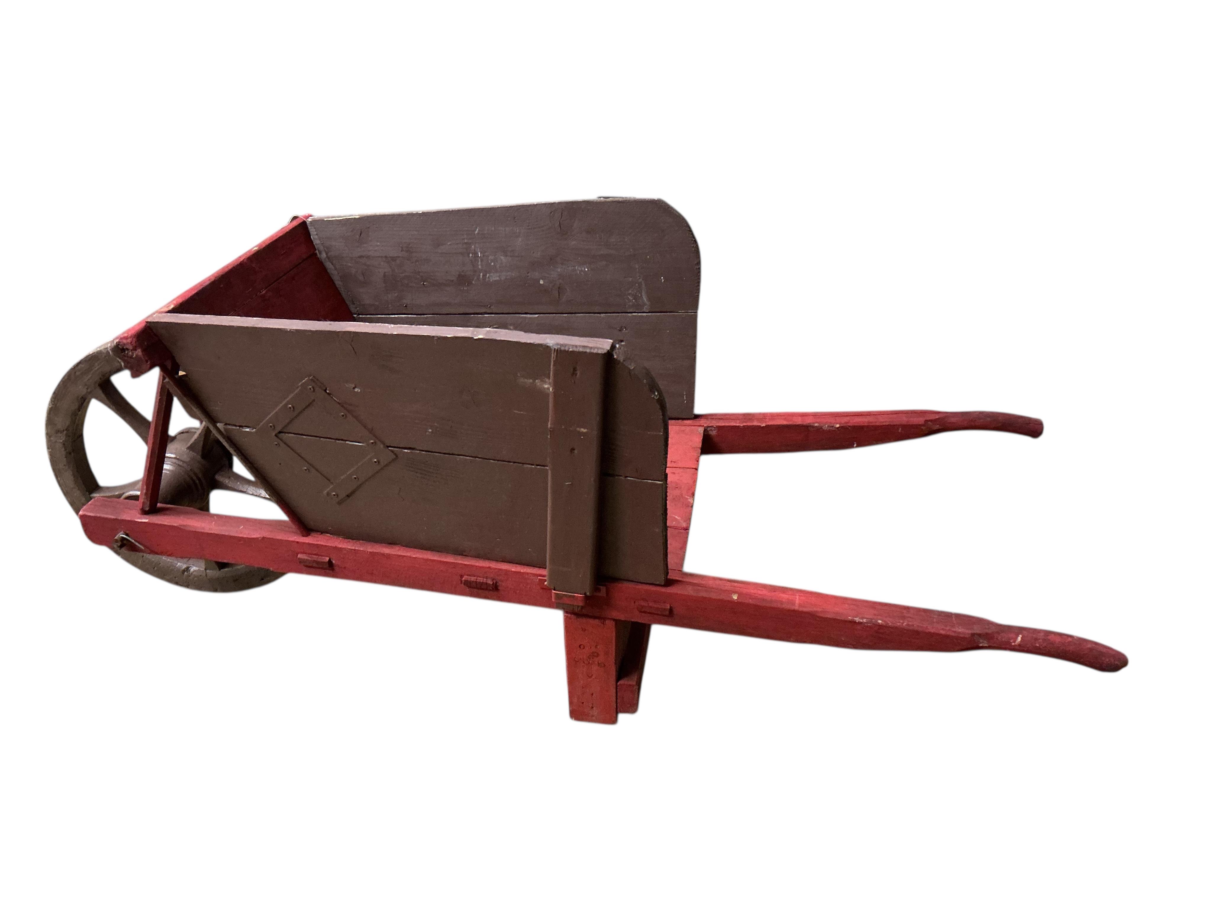 A painted rustic garden wheelbarrow, width 58cm, length 158cm, height 70cm